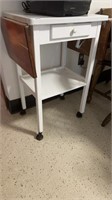 White rolling stand with fold up sides only