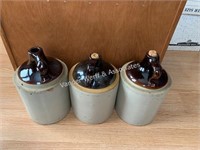 3) Stoneware jugs (brown tops)