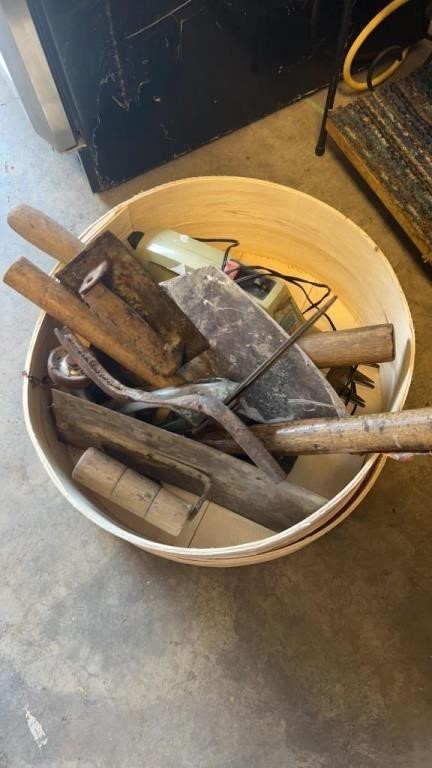 Assortment of vintage tools and basket