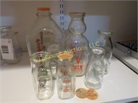 assorted vintage milk bottles