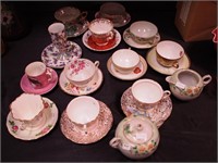12 vintage cups and saucers and a sugar and