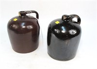 2- Brown stoneware jugs, chips around rim of each
