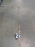 Old fishing pole with reel 9 ft. 6"