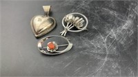 Silver heart? And brooches.