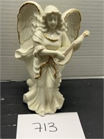 Vintage ceramic angel playing instrument decor