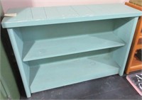 Blue-ish colored 3 level wood shelf