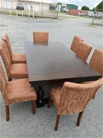 Modern table and 8 upholstered chairs look at