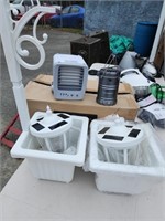 2 outdoor planters with solar lights and camp
