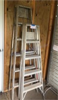 Two aluminum step ladders