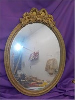 Oval framed ribbon mirror