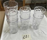 Seven plastic drinking glasses