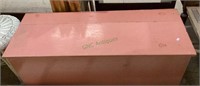 Vintage pink painted toy box with hinged lid on