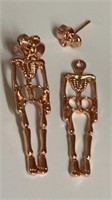 2 pc skeleton earrings. Skull in front, body