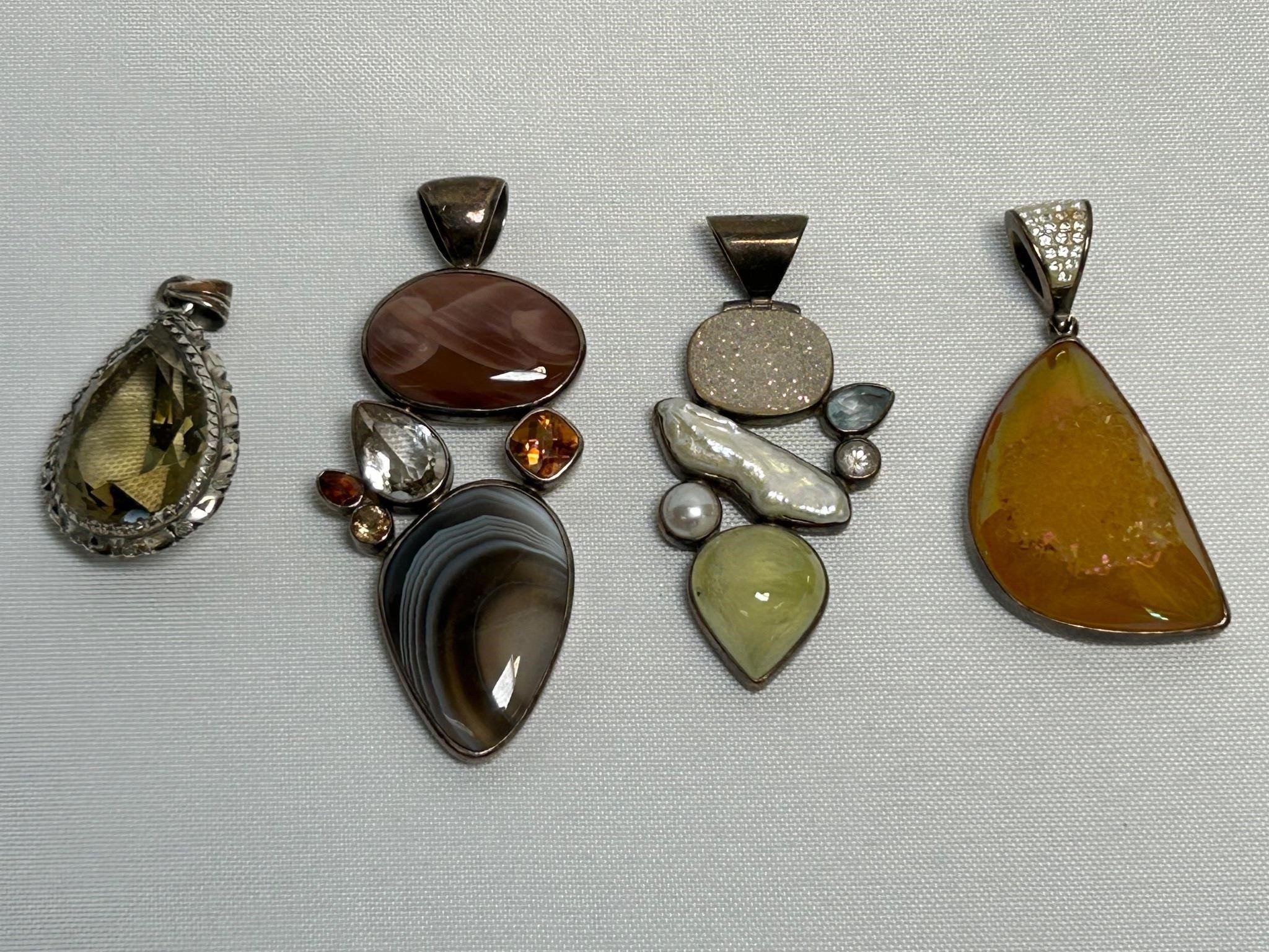 Four Pendants Marked either Sterling or 925
