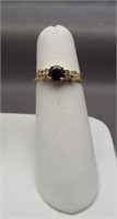 14K Yellow gold ring with dark blue center stone