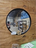 black framed wall mirror