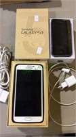 Samsung galaxy S5 phone & a used iPhone 4S in box