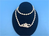 Phenomenal ivory necklace with relief carved penda