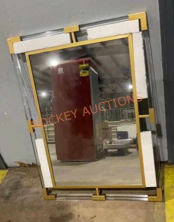 Clear and gold framed mirror