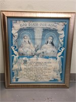 A beautiful, ornately framed religious art work, s