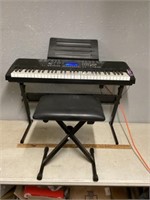 Electric keyboard works as it should with stool