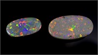 Two loose black-dark solid opals