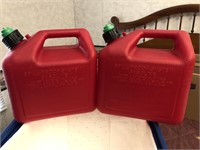 Pair of gas cans in blue crate