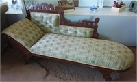Antique chaise lounger on wheels