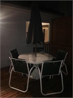 Outdoor table with chairs and umbrella