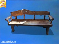large wooden hand carved bench rustic