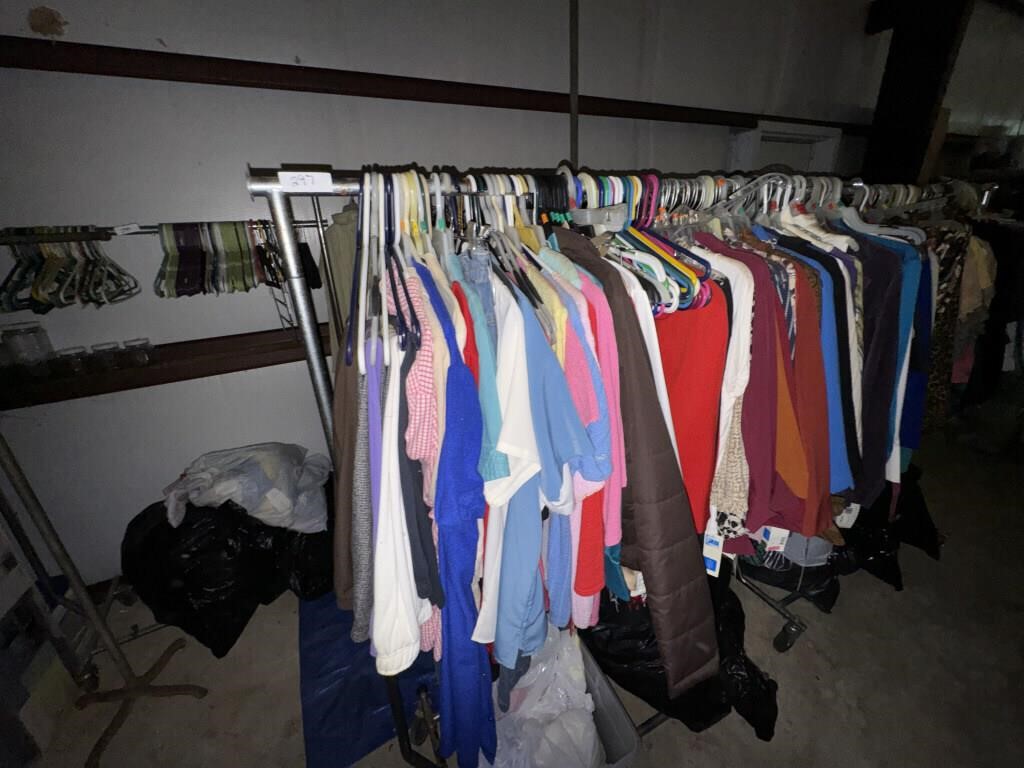 TWO RACKS AND CLOTHING