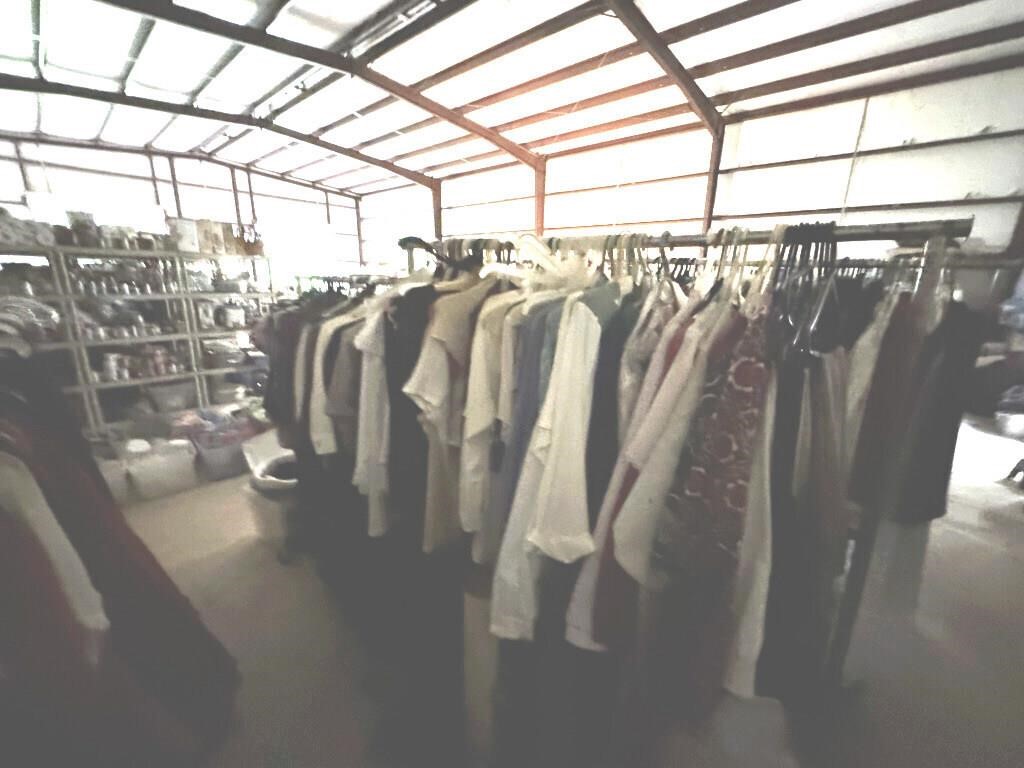 TWO RACKS AND CLOTHING