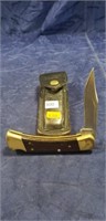 (1) Buck Knife w/ Leather Sheath
