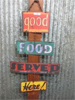 Good food served here hanging sign