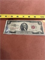 Series 1953 red seal two dollar bill.