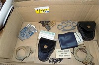 POLICE ITEMS, 2 SETS OF HANDCUFFS, KNUCKLES,