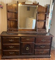 Dresser with mirrored top. 7 drawers and one