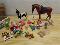 Plastic toy horses and vintage toys.