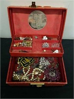 Small vintage jewelry box with vintage jewelry