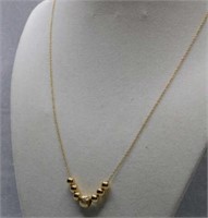 14K y gold 24" add-a-bead necklace, 7 beads