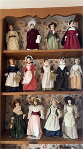 Collection of 13 collector dolls, on stands, from