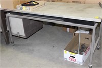 large metal rolling desk