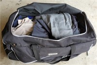 Rolling duffel bag with L/XL men's clothing and