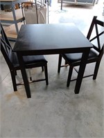 Kitchen table w 2 chairs. Chairs have bee chewed