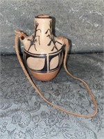 A- 4.5in pottery vase with rope.