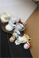 LOT OF 10 PAINTED WATER PITCHERS AND CREAMERS