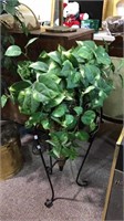 Fake plant in a nice black metal stand with the