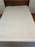 Cream colored bedspread w/raised design