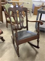 Vintage wooden rocking chair with leather seat,
