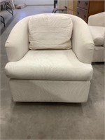 Cream colored swivel barrel chair, shipping not